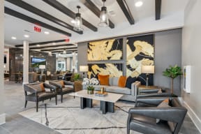 a lobby with couches and chairs and a coffee table