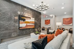 a living room with a couch and a chandelier