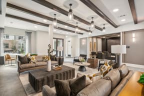 a living room with couches and chairs and a table