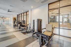 a room filled with lots of different types of exercise equipment