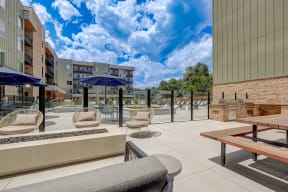 a patio with chairs tables and umbrellas at the bradley braddock road station