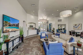 a living room with couches and chairs and a tv