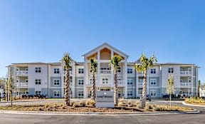 A large apartment complex named Eastwood with a clear blue sky in the background.