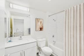 a bathroom with a sink toilet and a shower