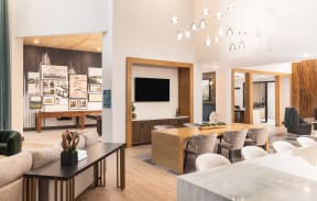 a living room and dining room with a table and chairs