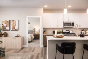 a kitchen with white cabinets and a white counter top