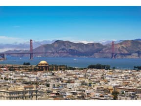 a view of the golden gate bridge and san francisco from treasure island