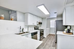 Kitchen with Stainless Steel Appliances at The Julia Apartments, Mesa, AZ, 85210