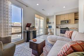 A living room with a couch, chair, and coffee table.