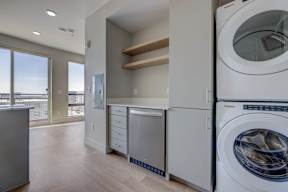 A modern laundry room with a washer and dryer.