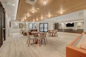 A modern dining room with a pool table.