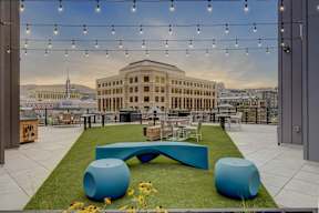 Rooftop lounge with city skyline views at Luma apartments in Salt Lake City.