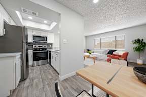 Modern kitchen with dining area at Newport apartments in Avondale, AZ.