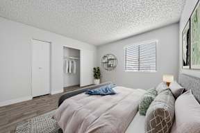 Bedroom with open closet at Newport apartments in Avondale, AZ.