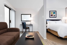 1 BR Apartments in Sunnyvale, CA - mResidences Silicon Valley - Living Room Featuring Wood-Style Flooring, Couch, Desk, and Chair