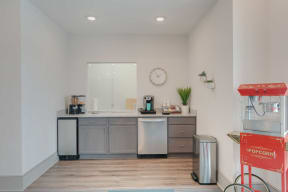 a kitchen with a counter and a sink and a mirror