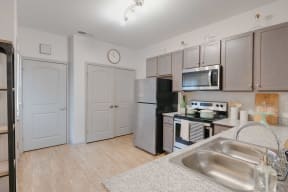 a kitchen with stainless steel appliances and a sink