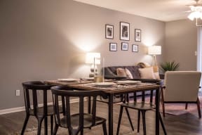 a dining room with a table and chairs and a couch