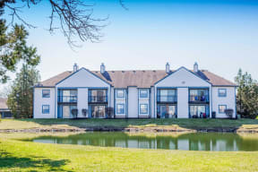 a building with a pond in front of it