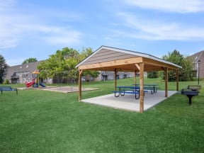 a rendering of a park with benches and a pavilion