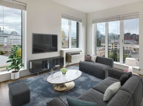 a living room with a couch and a coffee table and a television