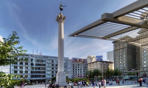 a city with a statue on top of a column