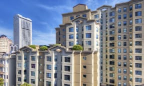 a rendering of an apartment building with a green roof
