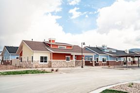 a row of houses on the side of a street