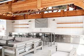 the lobby of a restaurant with tables and chairs