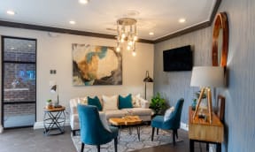 a living room with a couch and a chandelier