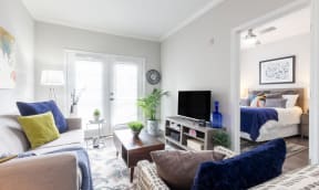 a living room with a couch and a tv
