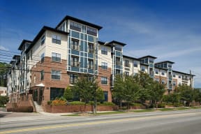 an apartment building on the corner of a street