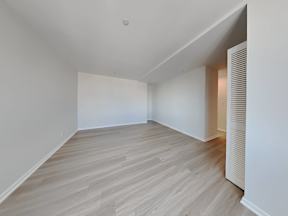 a living room with white walls and wood floors at 1700 California Street, San Francisco, CA, 94109