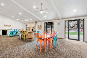 A room with a table and chairs in it.
