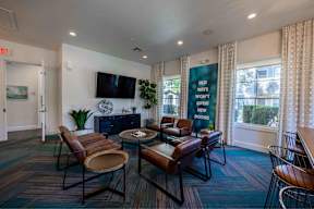 A living room with a sign that says