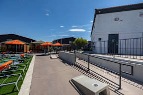 A sunny day at the outdoor seating area with orange umbrellas.