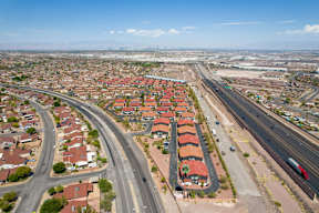 A suburban area with a road running through it.