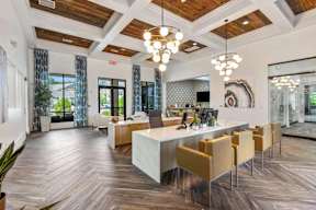 A modern dining room with a long table and chairs.