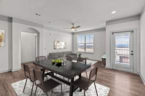 A dining room with a table set for two.