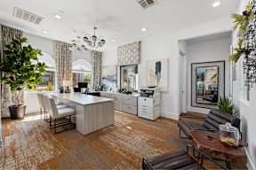 a living room with a kitchen and a dining room
