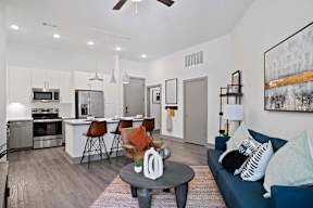 A modern kitchen with a dining table and chairs.