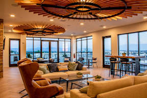 A modern living room with a large window overlooking the city.
