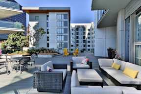 Outdoor terrace with seating at Soma Towers apartments in Bellevue, WA
