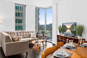 Living room with dining area at Soma Towers apartments in Bellevue, WA