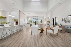 A modern living room with wooden floors and furniture.