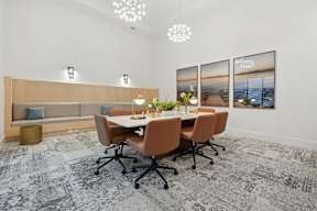 A conference room with a long table and chairs.