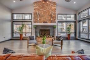 Large clubhouse with vaulted ceilings, pool table, sitting area, and fireplace