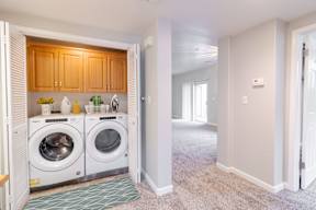 A laundry room with a washer and dryer in it.