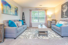 a living room with couches and a coffee table