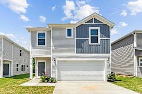 A modern two-story house with a garage.